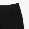 Damesbroek met hoge taille en uitlopende pijpen