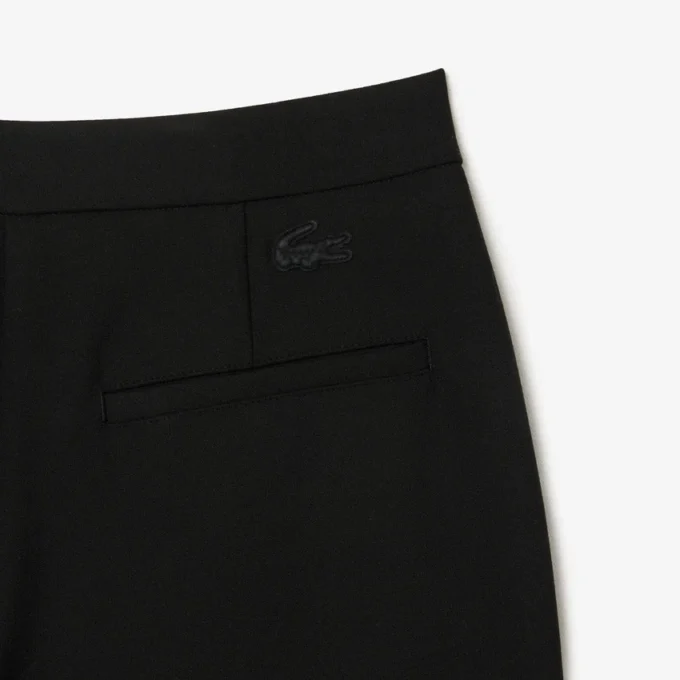 Damesbroek met hoge taille en uitlopende pijpen