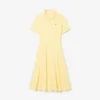 Flared Mini-Piqua polojurk voor dames