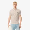 L.12.12 Piqué-polo voor heren met slanke pasvorm