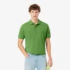 Petit Piqua-polo met klassieke pasvorm en geborduurde details