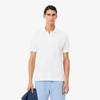 Petit Piqua-polo met klassieke pasvorm en geborduurde details