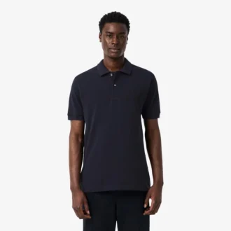 Petit Piqua-polo met klassieke pasvorm en geborduurde details