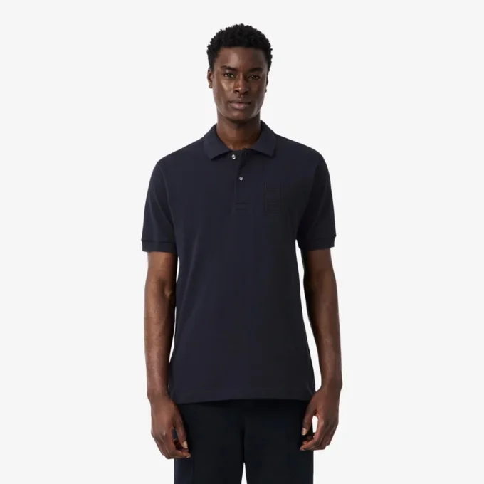 Petit Piqua-polo met klassieke pasvorm en geborduurde details
