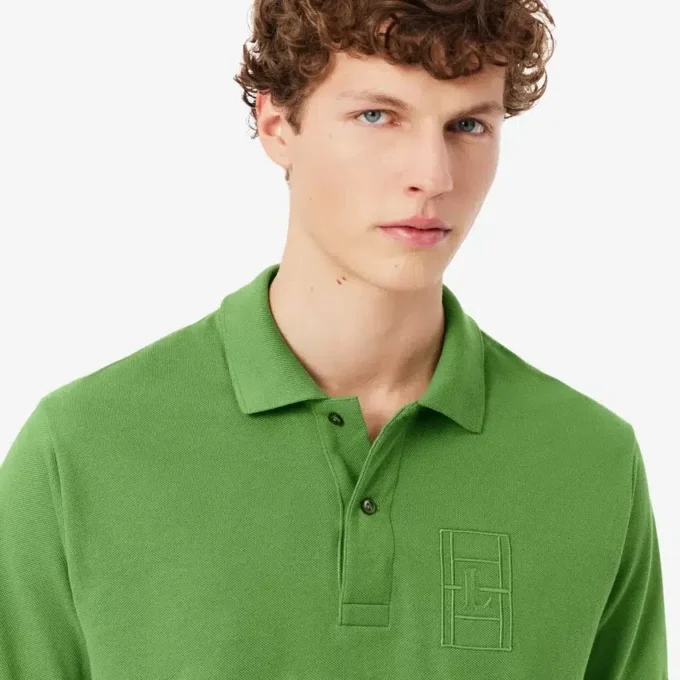 Petit Piqua-polo met klassieke pasvorm en geborduurde details