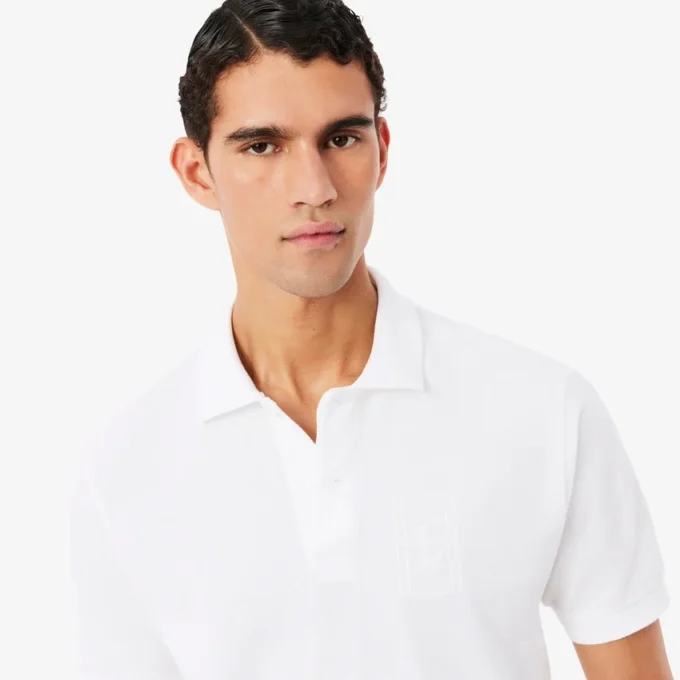 Petit Piqua-polo met klassieke pasvorm en geborduurde details