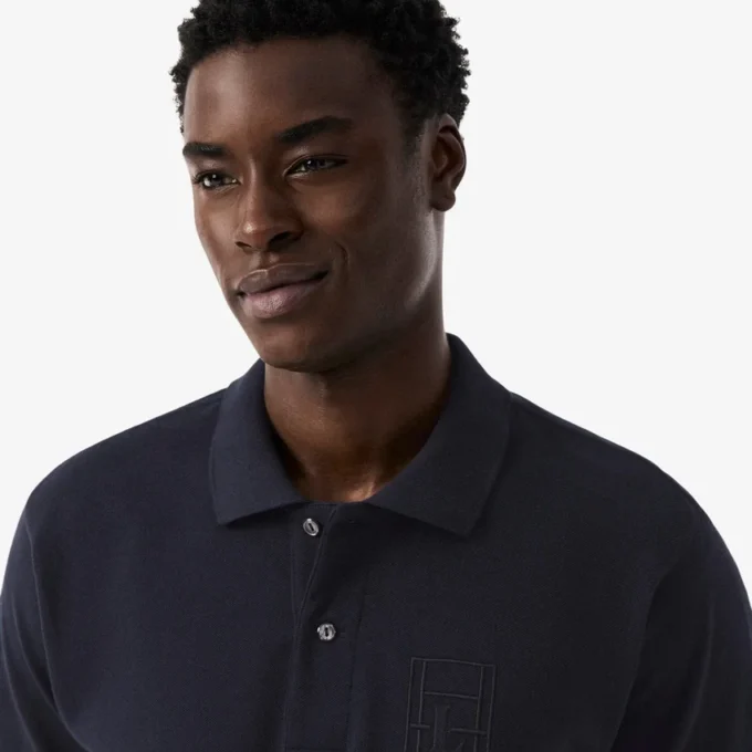 Petit Piqua-polo met klassieke pasvorm en geborduurde details