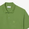 Petit Piqua-polo met klassieke pasvorm en geborduurde details