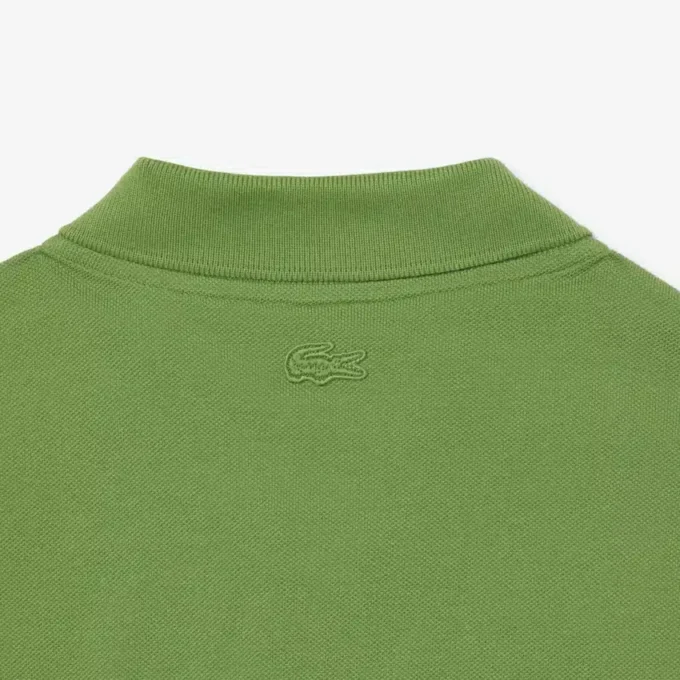 Petit Piqua-polo met klassieke pasvorm en geborduurde details