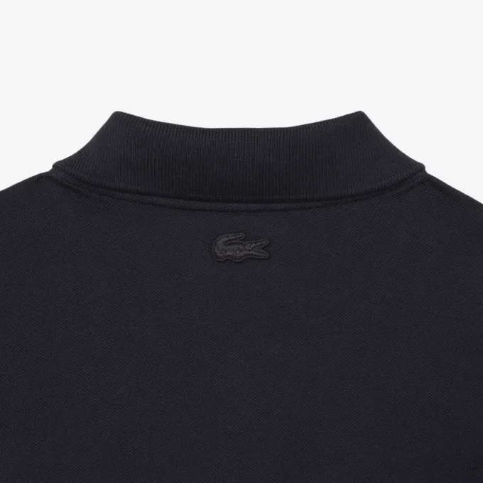 Petit Piqua-polo met klassieke pasvorm en geborduurde details