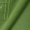 Petit Piqua-polo met klassieke pasvorm en geborduurde details