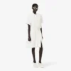 Runway-polojurk met plooien en borduursels