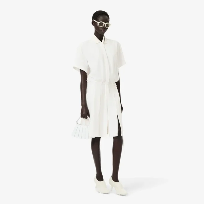 Runway-polojurk met plooien en borduursels
