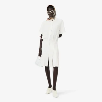 Runway-polojurk met plooien en borduursels