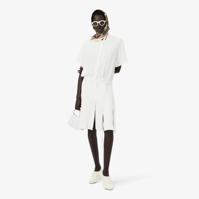 Runway-polojurk met plooien en borduursels