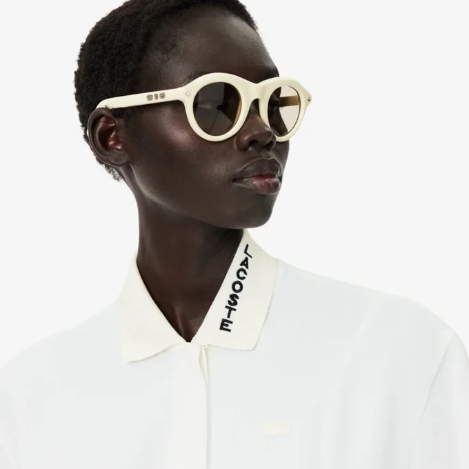Runway-polojurk met plooien en borduursels