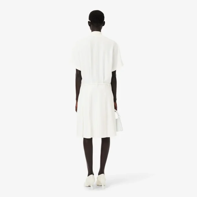 Runway-polojurk met plooien en borduursels
