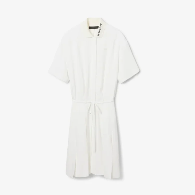 Runway-polojurk met plooien en borduursels
