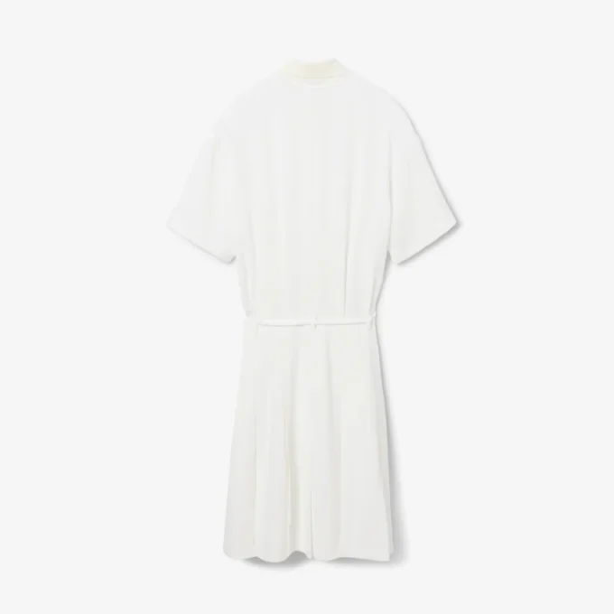 Runway-polojurk met plooien en borduursels