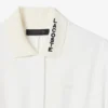 Runway-polojurk met plooien en borduursels
