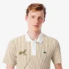 Thermoregulerende gestreepte golfpolo voor heren